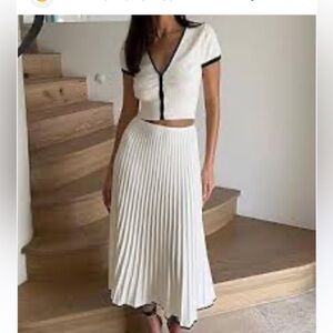 Elegant cream with black trim knit set with cropped top and pleated skirt size S